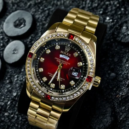 Gold Watch with Red Sunburst Dial and Crystal Bezel