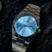 Silver stainless-steel PRX watch with light blue ice-blue dial