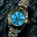 Two tone ladies dual time zone watch with lime blue dial and annual calendar, elegant travel style wristwatch